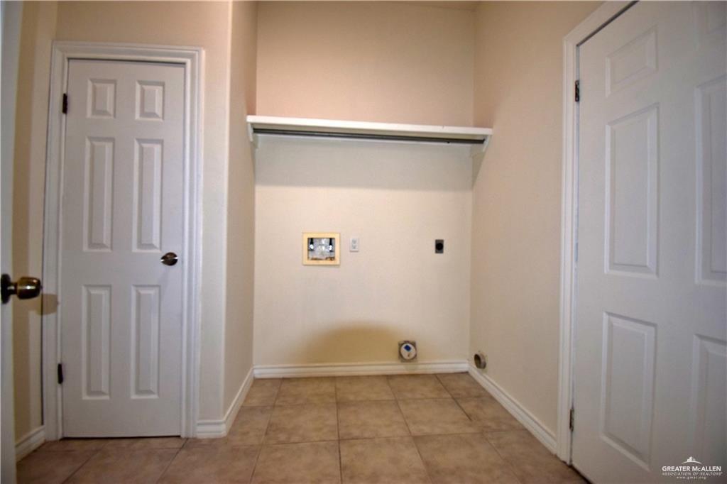 1104 Rio Balsas Mission, TX 78572 - Photo 17 of 20 Washroom featuring washer hookup, hookup for an electric dryer, and light tile patterned floors