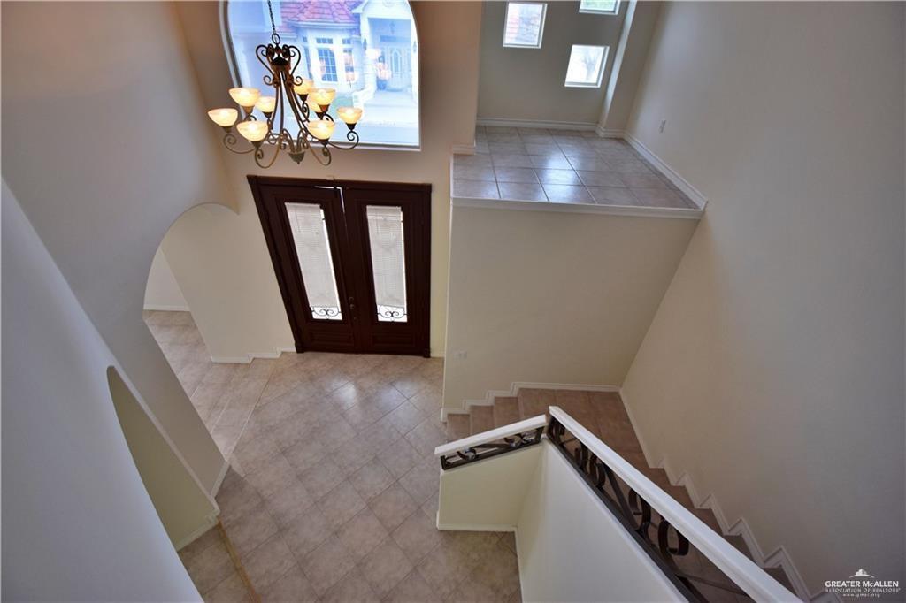 1104 Rio Balsas Mission, TX 78572 - Photo 7 of 20 Foyer featuring light tile patterned floors, a chandelier, and french doors