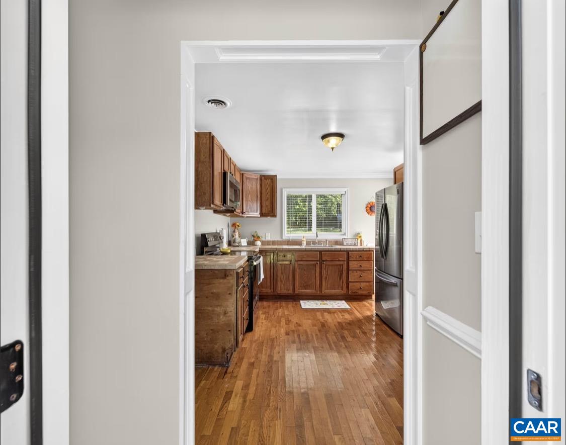 5512 Secretarys Sand Road Esmont, VA 22937 - Photo 15 of 30 Back door to kitchen