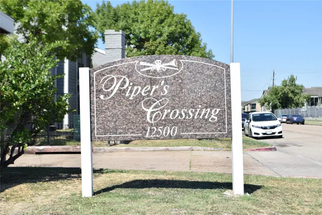 a view of a sign board with yard