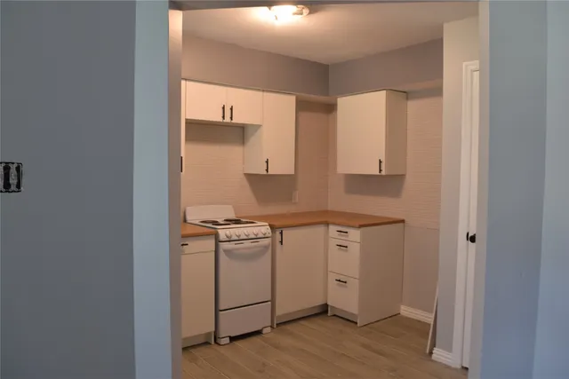 a kitchen with a stove and a refrigerator