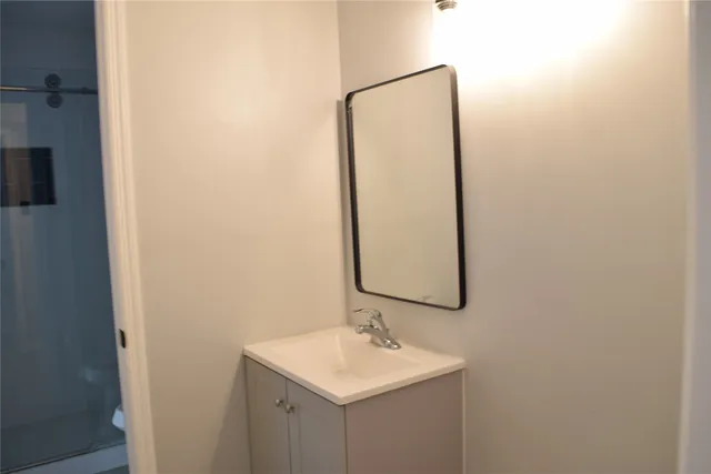 a bathroom with a sink and a mirror