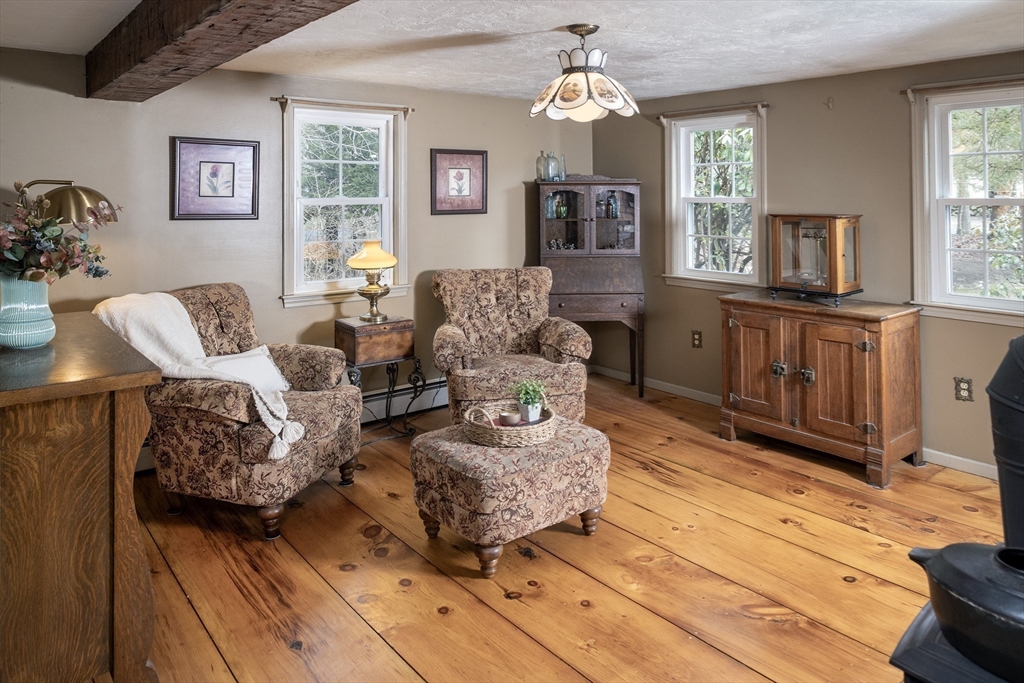 66 Main Street Plympton, MA 02367 - Photo 3 of 31 a living room with furniture chandelier and a window
