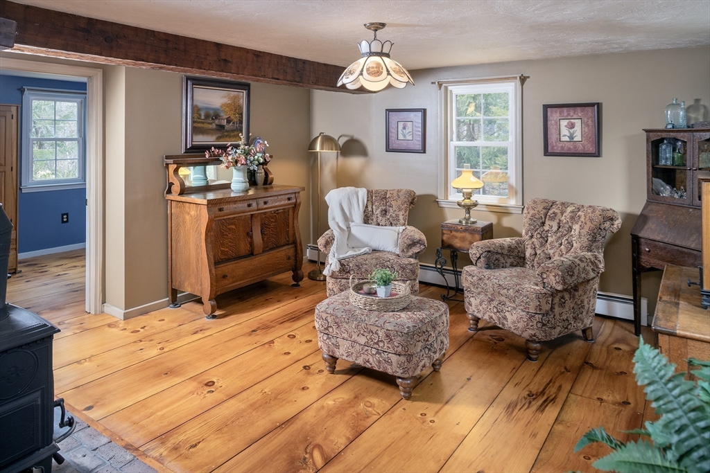 66 Main Street Plympton, MA 02367 - Photo 4 of 31 a living room with furniture and a chandelier