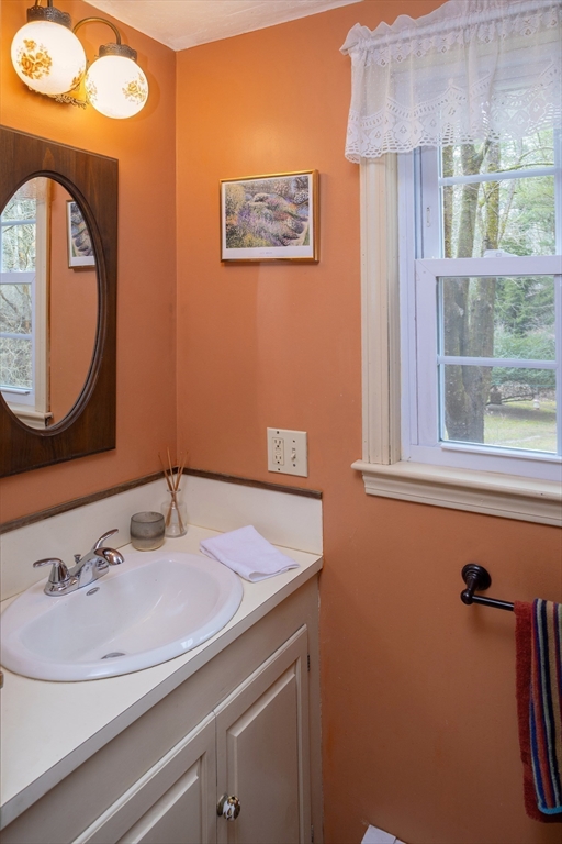 66 Main Street Plympton, MA 02367 - Photo 6 of 31 a bathroom with a sink and a mirror