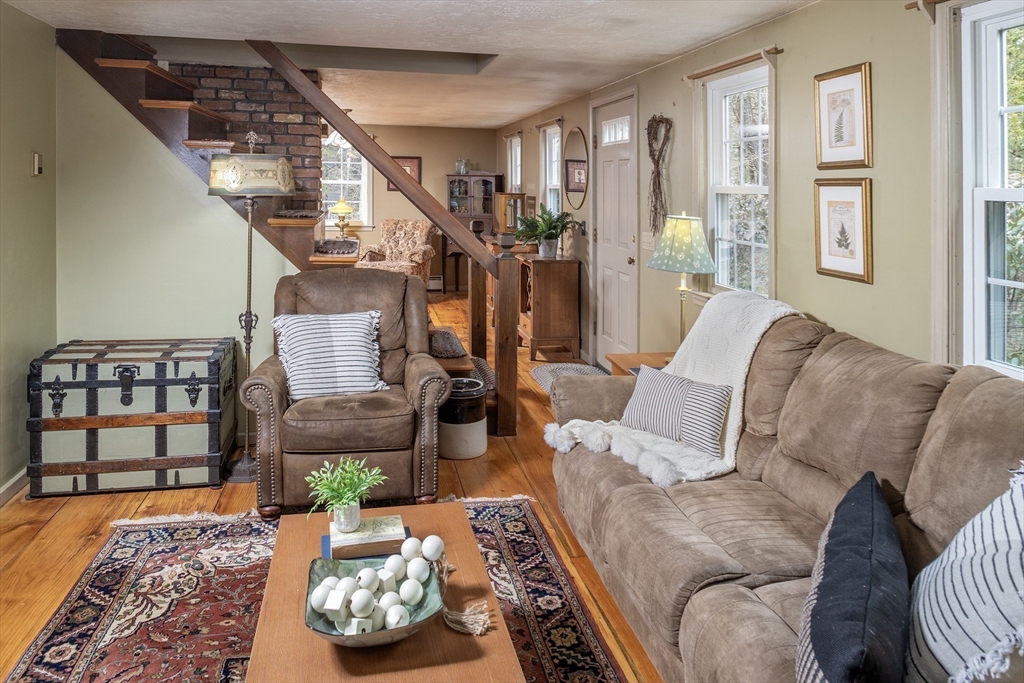 66 Main Street Plympton, MA 02367 - Photo 8 of 31 a living room with furniture and wooden floor