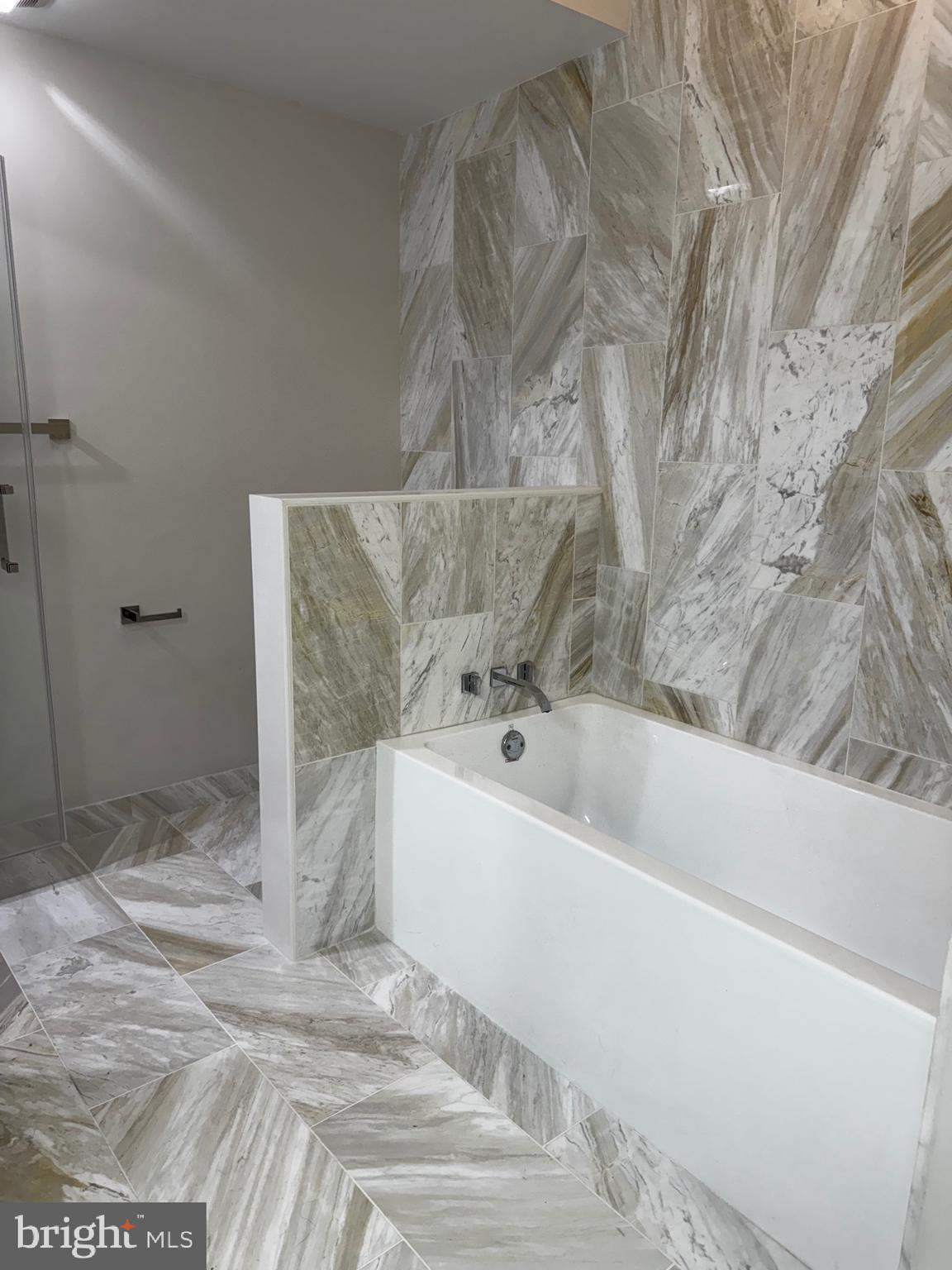 417 North Front Street Philadelphia, PA 19123 - Photo 11 of 11 a bathroom with a bathtub and a shower