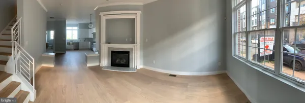 a view of a living room with windows