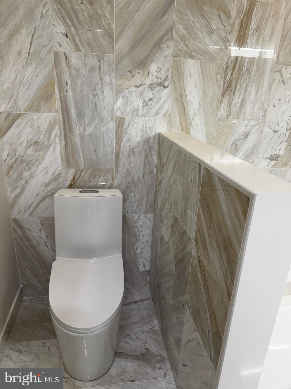 417 North Front Street Philadelphia, PA 19123 - Photo 8 of 11 a white toilet sitting next to a shower