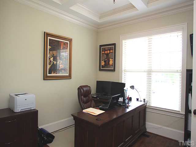 828 Boone Ridge Lane Cary, NC 27519 - Photo 4 of 25 The first floor bedroom with coffered ceiling detail serves as an ideal office.