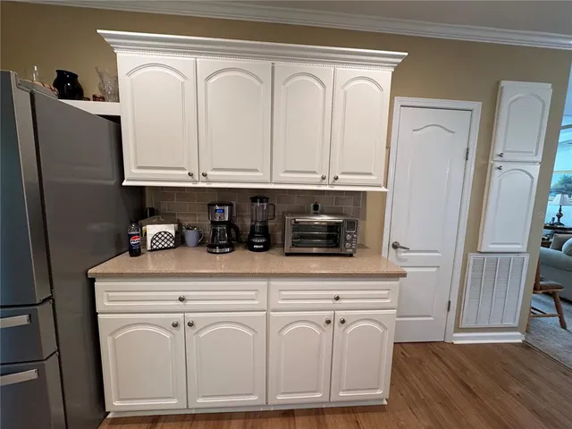 a white refrigerator freezer sitting inside of a kitchen
