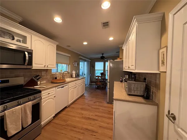 a view of storage and utility room with washer and dryer
