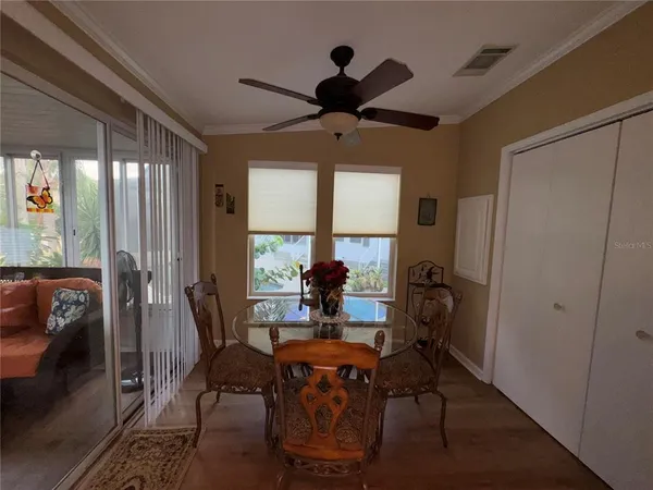 a room with lots of wooden furniture and a window