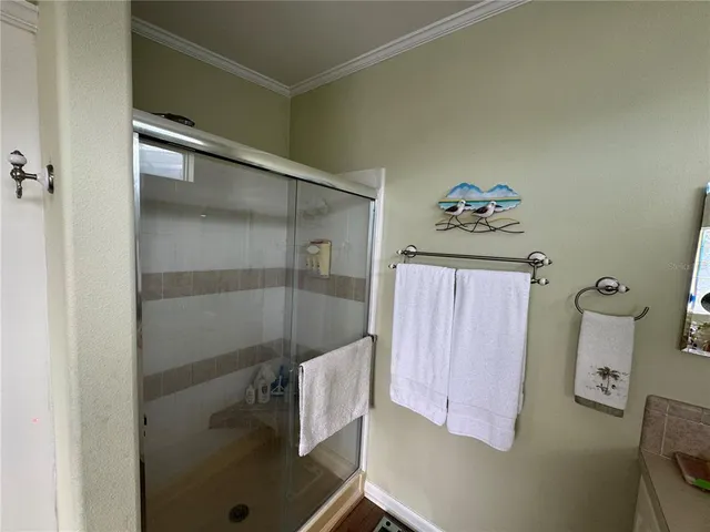 a bedroom with a bed and a tv on the dresser