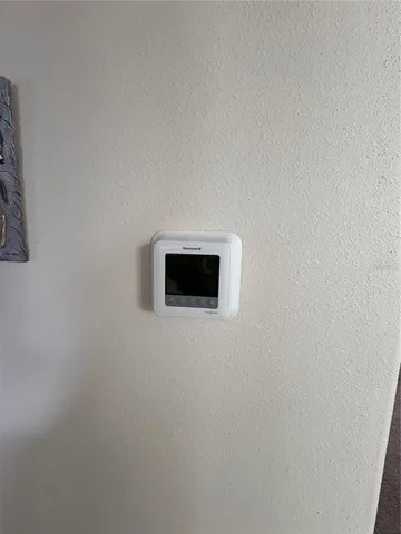 a bathroom with a toilet sink and shower