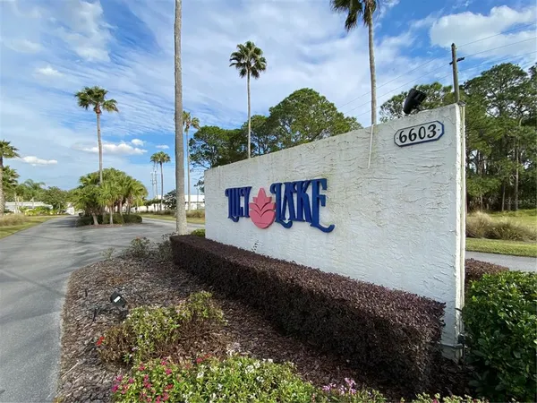 a living room with lots of furniture and a dining table