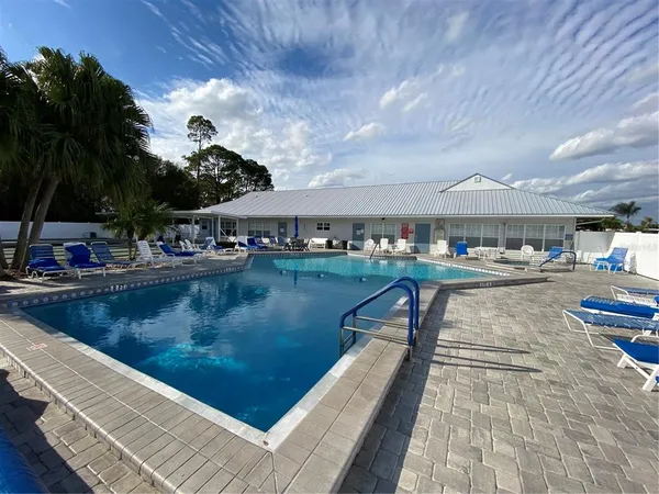 a bathroom with a sink toilet and window