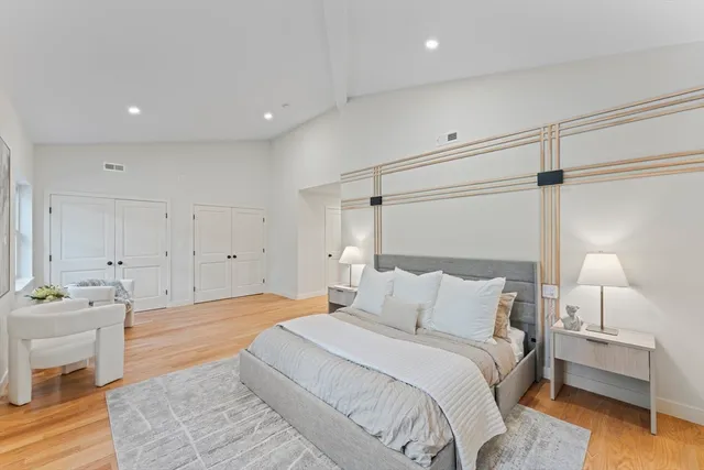 a bedroom with a bed and a table