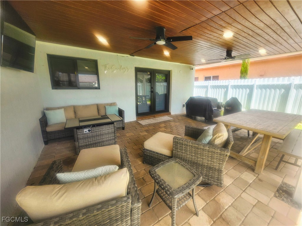 17833 Southwest 155th Court Miami, FL 33187 - Photo 21 of 22 a living room with furniture and a flat screen tv