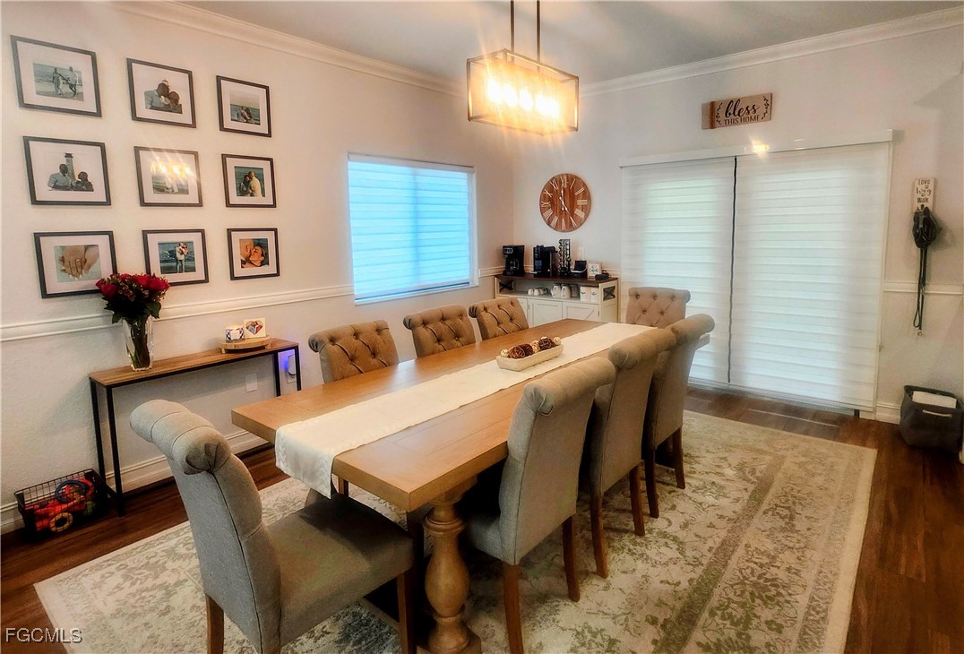 17833 Southwest 155th Court Miami, FL 33187 - Photo 4 of 22 a view of a dining room with furniture and chandelier