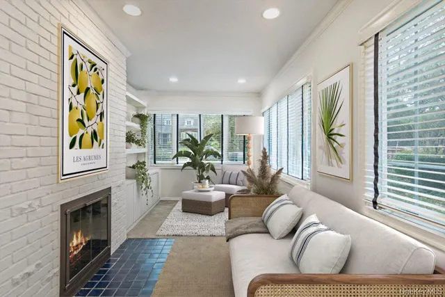 a living room with furniture and a fireplace