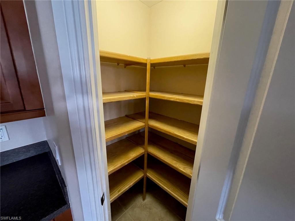 6082 Divot Court Naples, FL 34113 - Photo 13 of 39 a view of room with an empty space