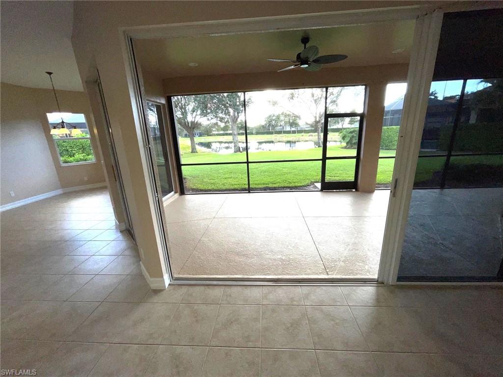 6082 Divot Court Naples, FL 34113 - Photo 19 of 39 a view of a room with wooden floor and a porch