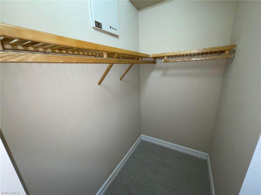 6082 Divot Court Naples, FL 34113 - Photo 28 of 39 a view of a room with racks on the wall