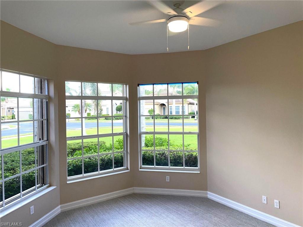 6082 Divot Court Naples, FL 34113 - Photo 30 of 39 a view of wooden floor and windows in a room