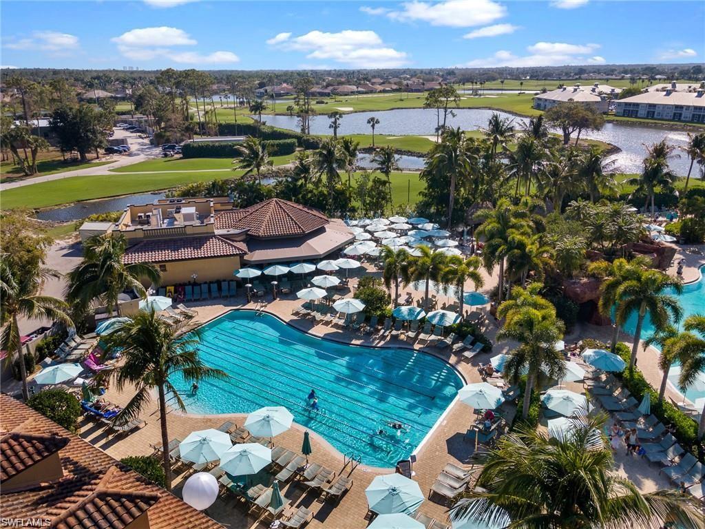 6082 Divot Court Naples, FL 34113 - Photo 38 of 39 a view of a lake with a lake