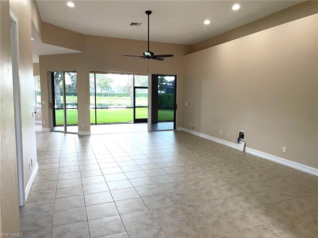6082 Divot Court Naples, FL 34113 - Photo 4 of 39 a view of an empty room with a window