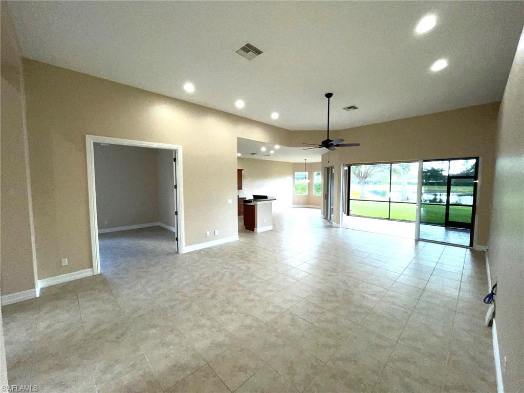 6082 Divot Court Naples, FL 34113 - Photo 6 of 39 a view of empty room with a kitchen