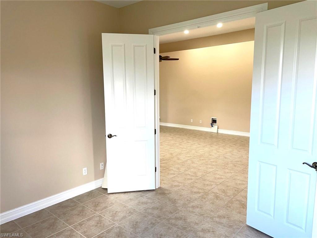 6082 Divot Court Naples, FL 34113 - Photo 7 of 39 a view of a bathroom with a shower