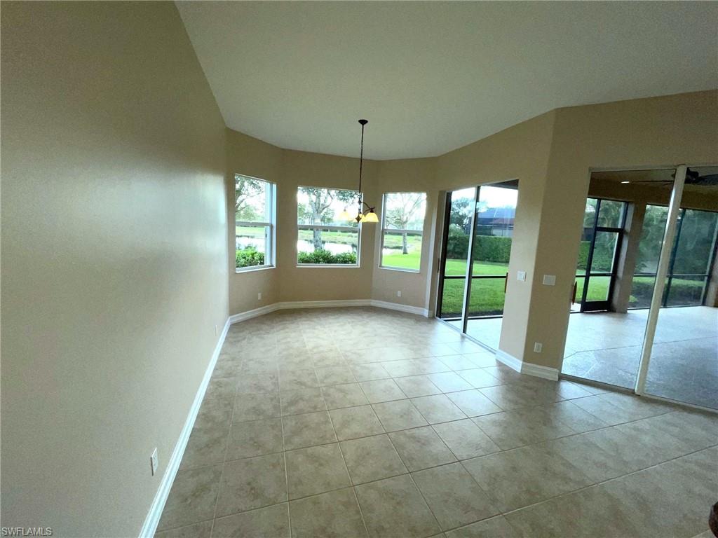 6082 Divot Court Naples, FL 34113 - Photo 8 of 39 a view of room with window and outdoor view