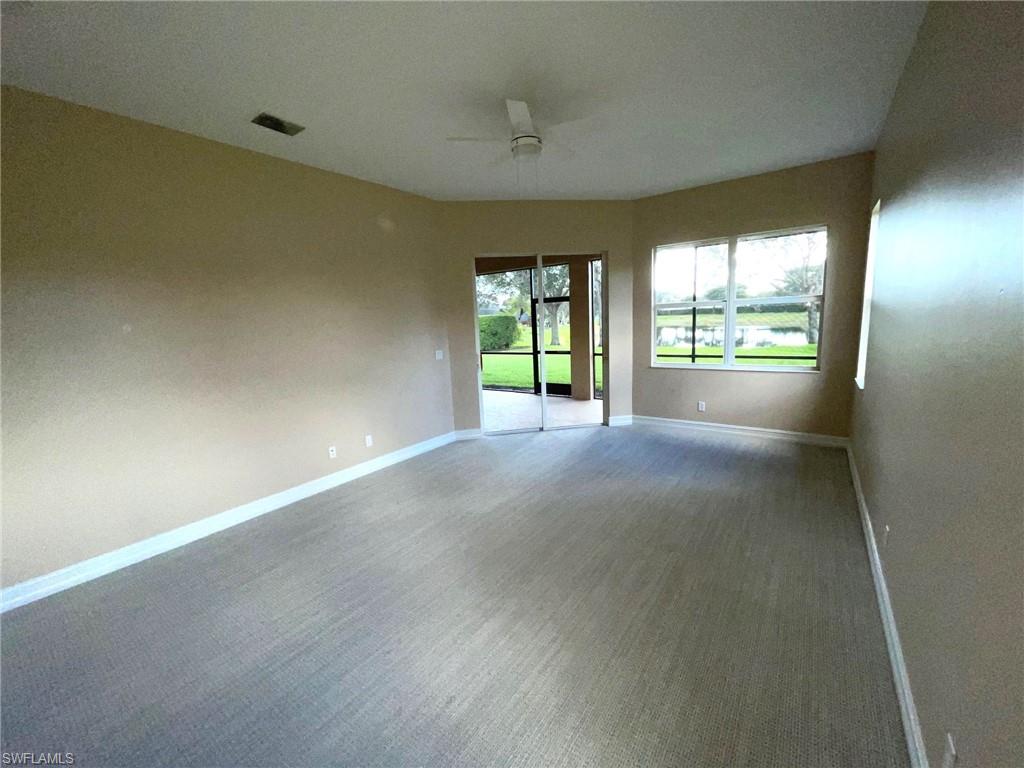 6082 Divot Court Naples, FL 34113 - Photo 9 of 39 an empty room with windows
