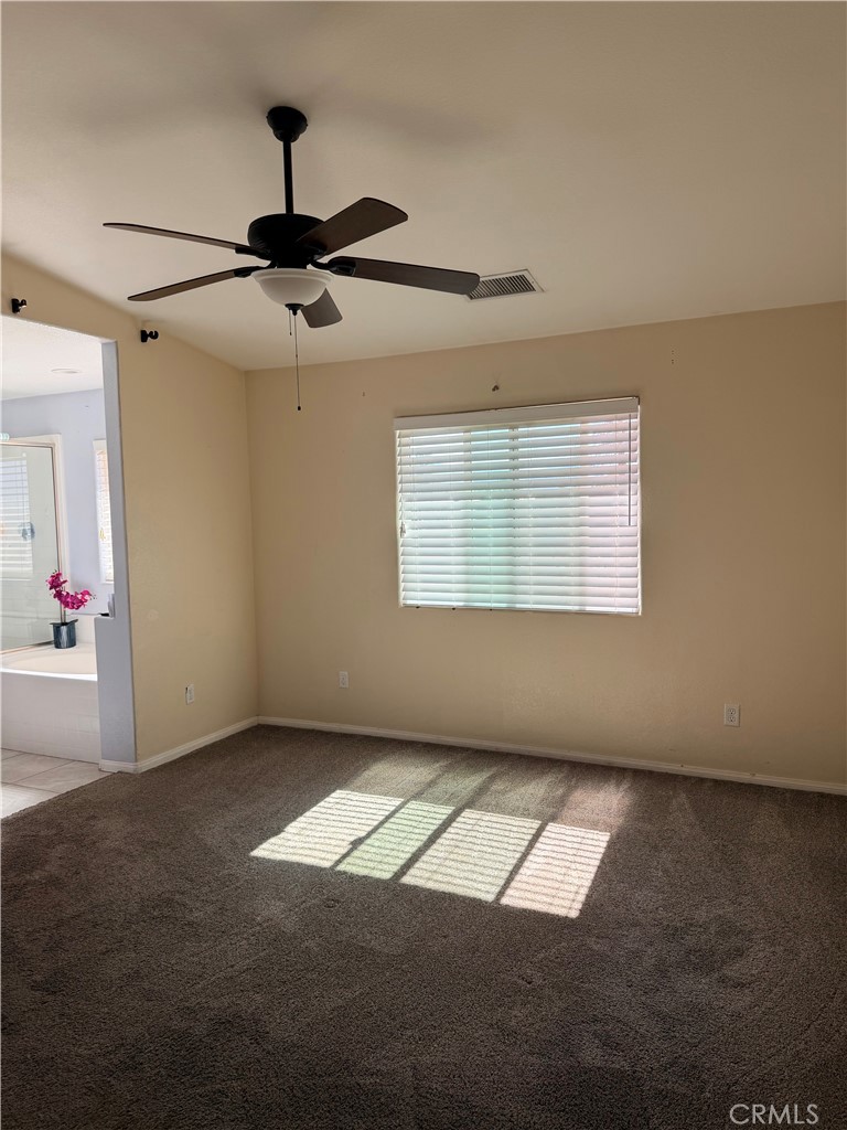 12833 Algonquin Road Apple Valley, CA 92308 - Photo 14 of 16 an empty room with windows