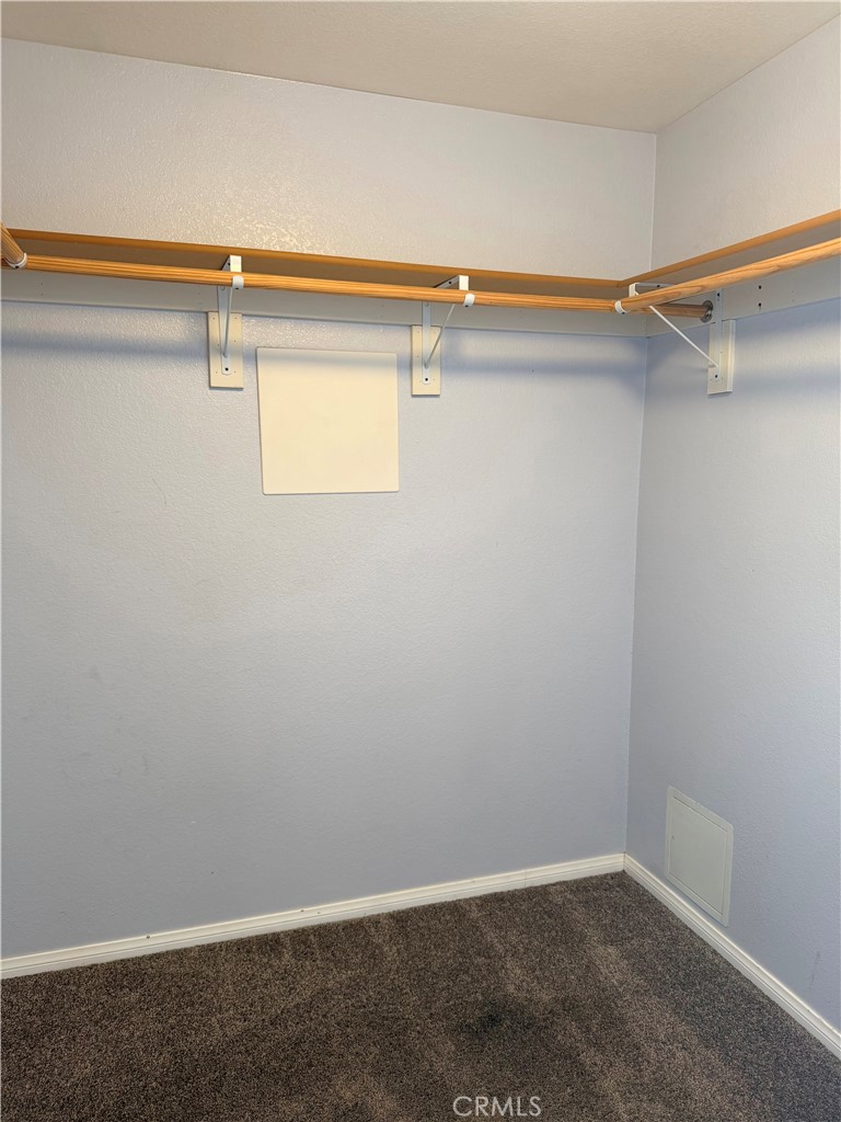 12833 Algonquin Road Apple Valley, CA 92308 - Photo 16 of 16 a view of a room with dryer and washer