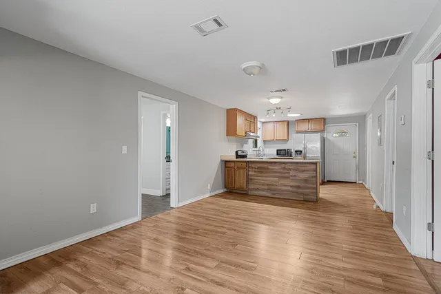 a view of kitchen with wooden floor
