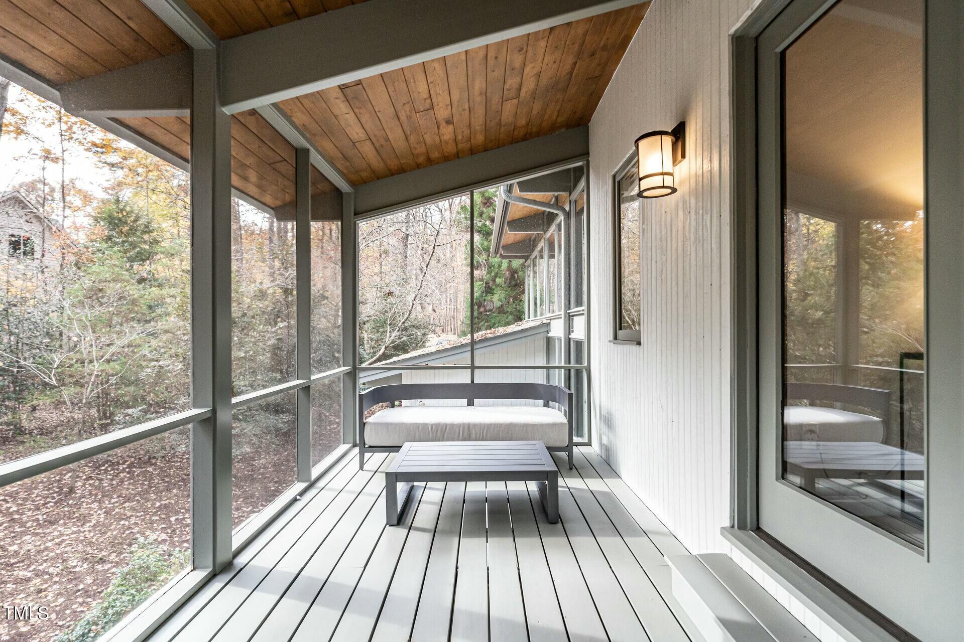 4824 Sandberry Lane Raleigh, NC 27613 - Photo 35 of 38 a view of balcony with a large window and wooden floor