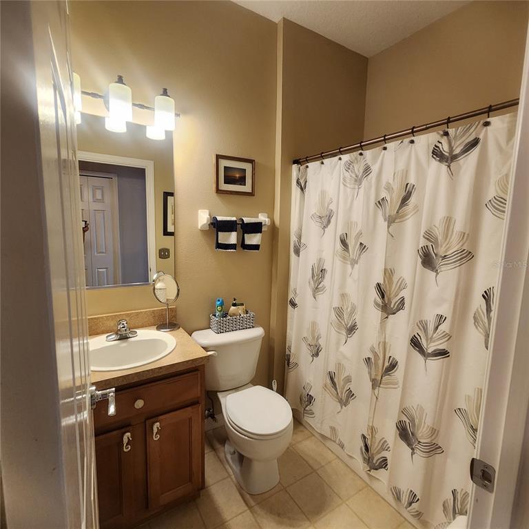 14982 Skip Jack Loop Lakewood Ranch, FL 34202 - Photo 17 of 28 a bathroom with a sink and a mirror