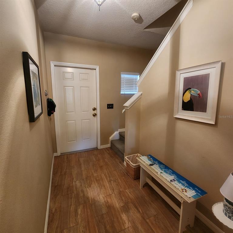 14982 Skip Jack Loop Lakewood Ranch, FL 34202 - Photo 10 of 28 a view of room with wooden floor and carpet