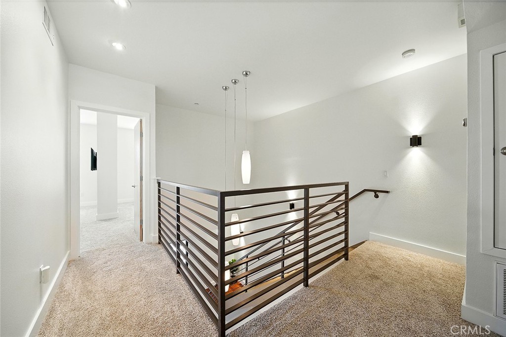 395 East 4th Street, Unit 39 Long Beach, CA 90802 - Photo 20 of 45 a view of hallway with stairs and wooden floor