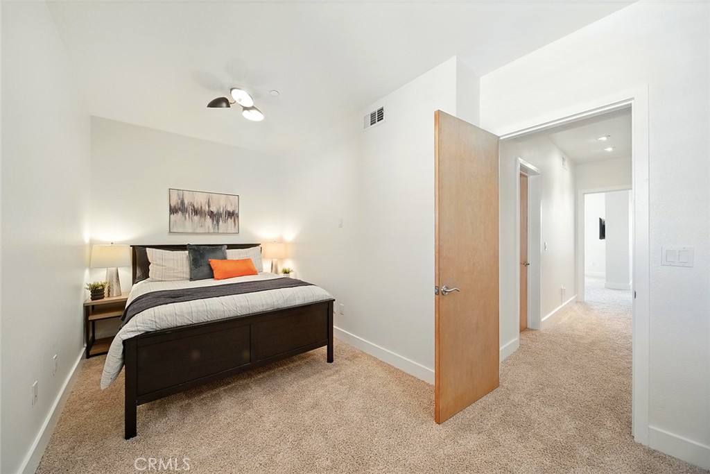 395 East 4th Street, Unit 39 Long Beach, CA 90802 - Photo 31 of 45 a bedroom with furniture and window