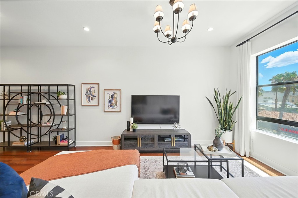 395 East 4th Street, Unit 39 Long Beach, CA 90802 - Photo 4 of 45 a living room with furniture and a flat screen tv