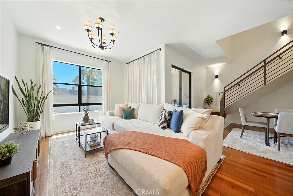 395 East 4th Street, Unit 39 Long Beach, CA 90802 - Photo 5 of 45 a bedroom with furniture and a large window