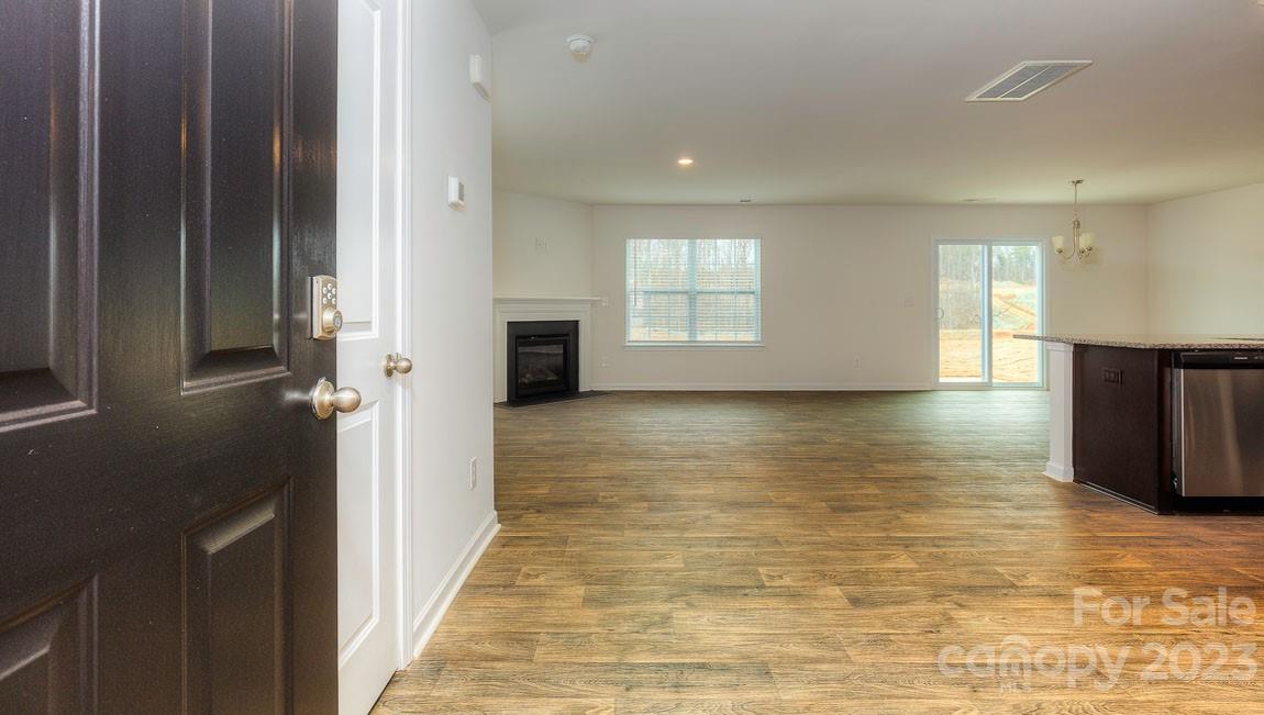 1603 Blue Velvet Lane Dallas, NC 28034 - Photo 2 of 17 a view of a room with wooden floor and staircase