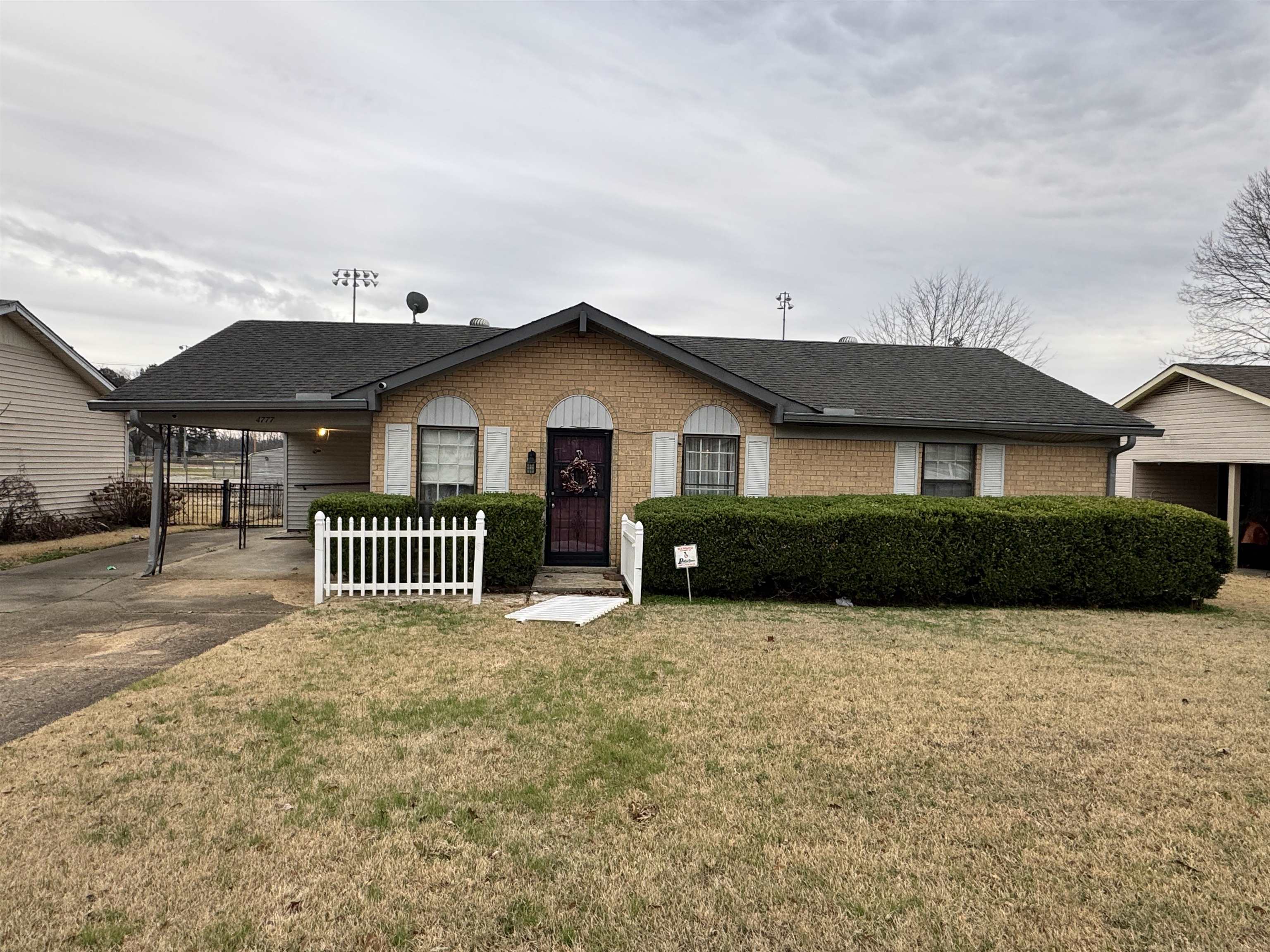 4777 Bill Knight Road Millington, TN 38053 - Photo 1 of 19 View of front of house featuring a carport, brick siding, a shingled roof, and driveway