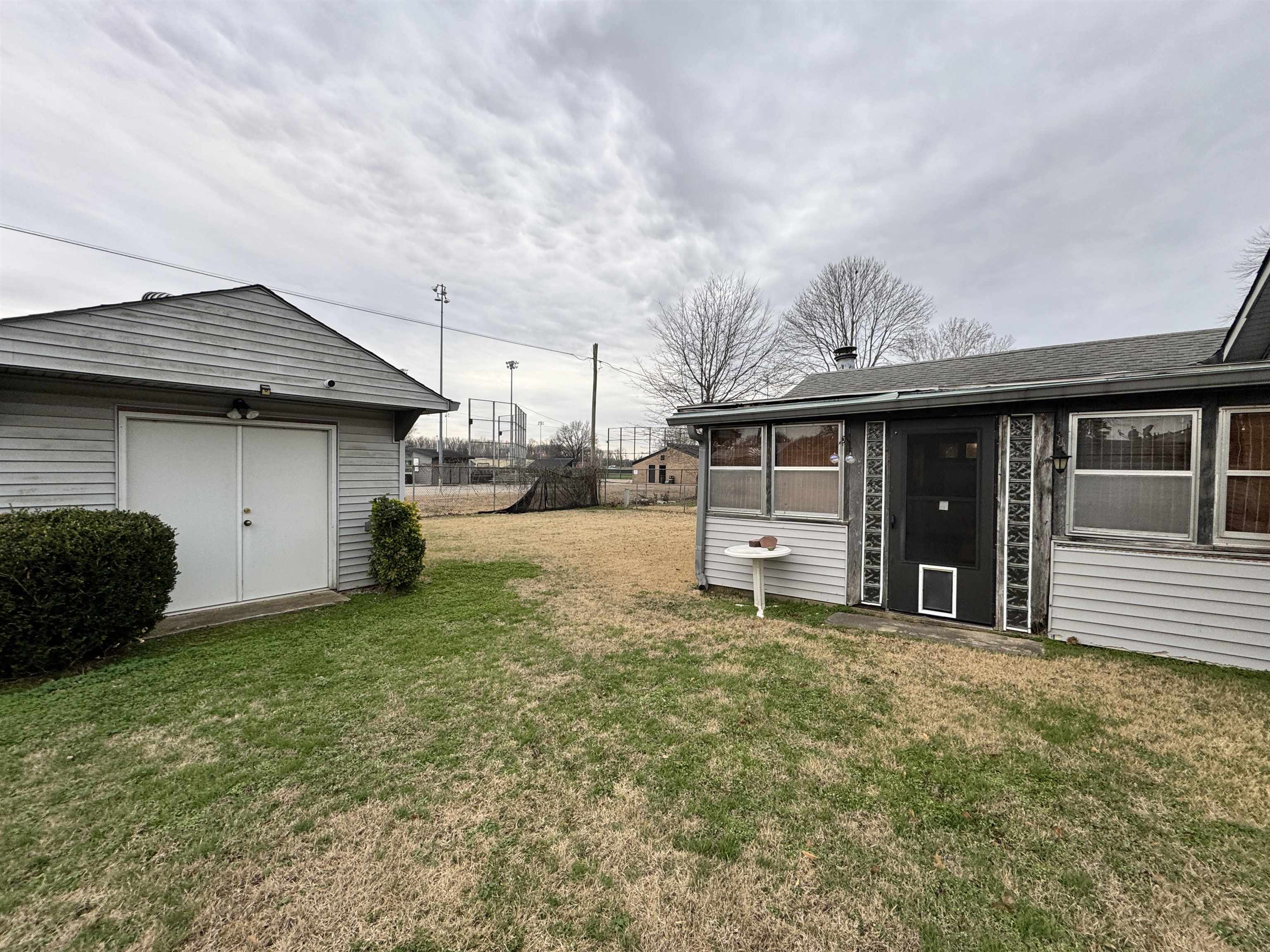 4777 Bill Knight Road Millington, TN 38053 - Photo 18 of 19 View of yard with a sunroom and an outdoor structure