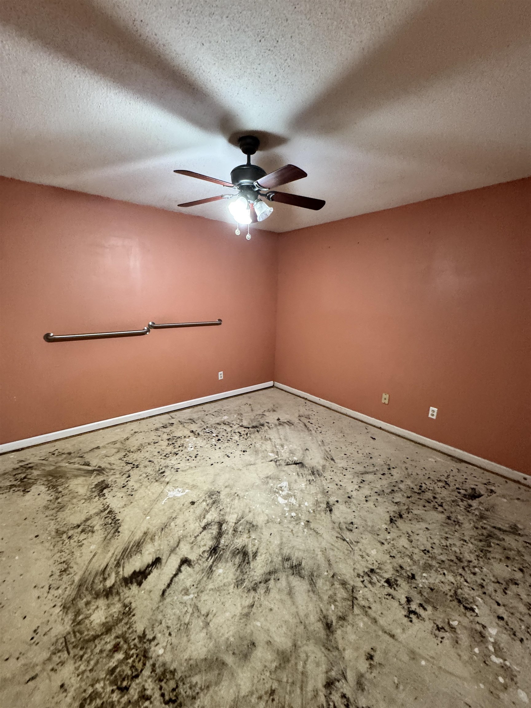 4777 Bill Knight Road Millington, TN 38053 - Photo 10 of 19 Unfurnished room featuring ceiling fan, a textured ceiling, and unfinished concrete floors