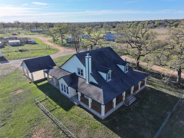 an aerial view of a house with a garden